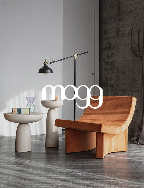 Ambiente de sal&oacute;n con mesa de centro Olo y butaca Talk de Mogg, perfectos para espacios contract